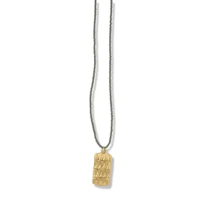 GOLD TRIBAL TAG NECKLACE ON CHARCOAL BEADS
